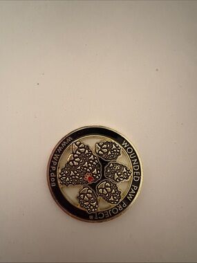 Wounded Paw Project Gold and Black Paw Token